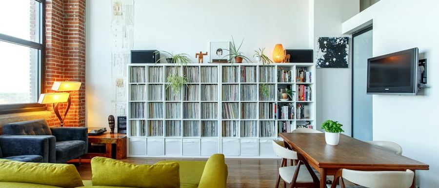 Wide view of an open-plan loft with bookshelves